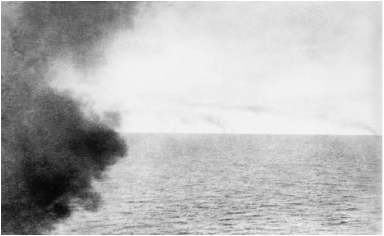 The German squadron's smoke on the horizon photographed from HMS Invincible