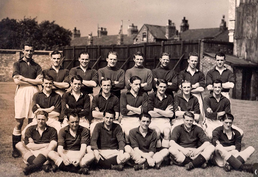 Everton squad circa 1950 on the training ground with Goodison Ave in background