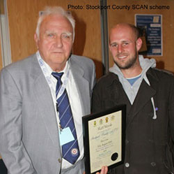 Matt Woods receiving his Stockport County appearance certificate in 2010